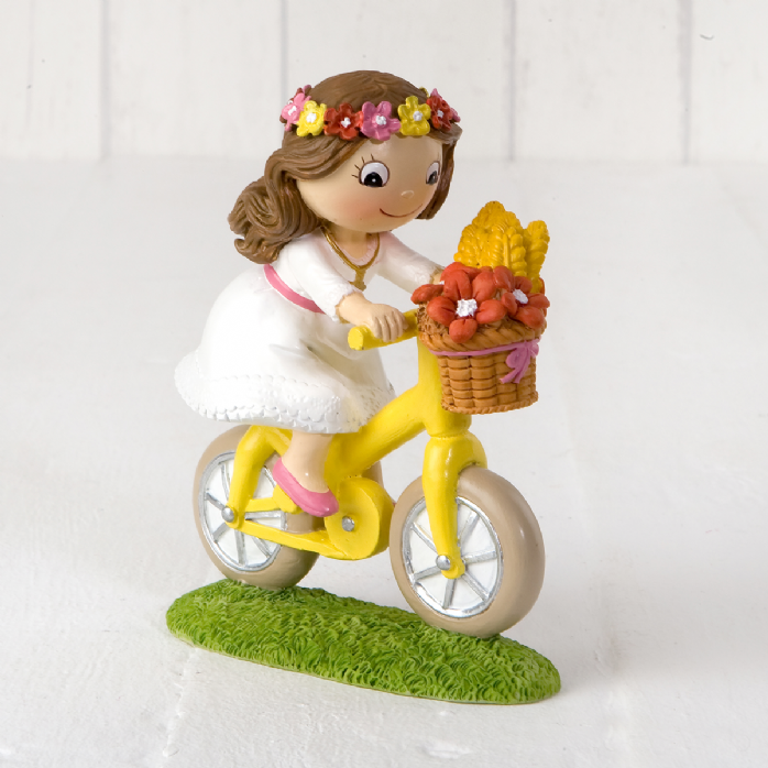 figura comunión niña en bici